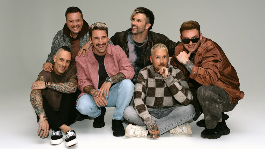 Electric Callboy band members stand together for a group photo.