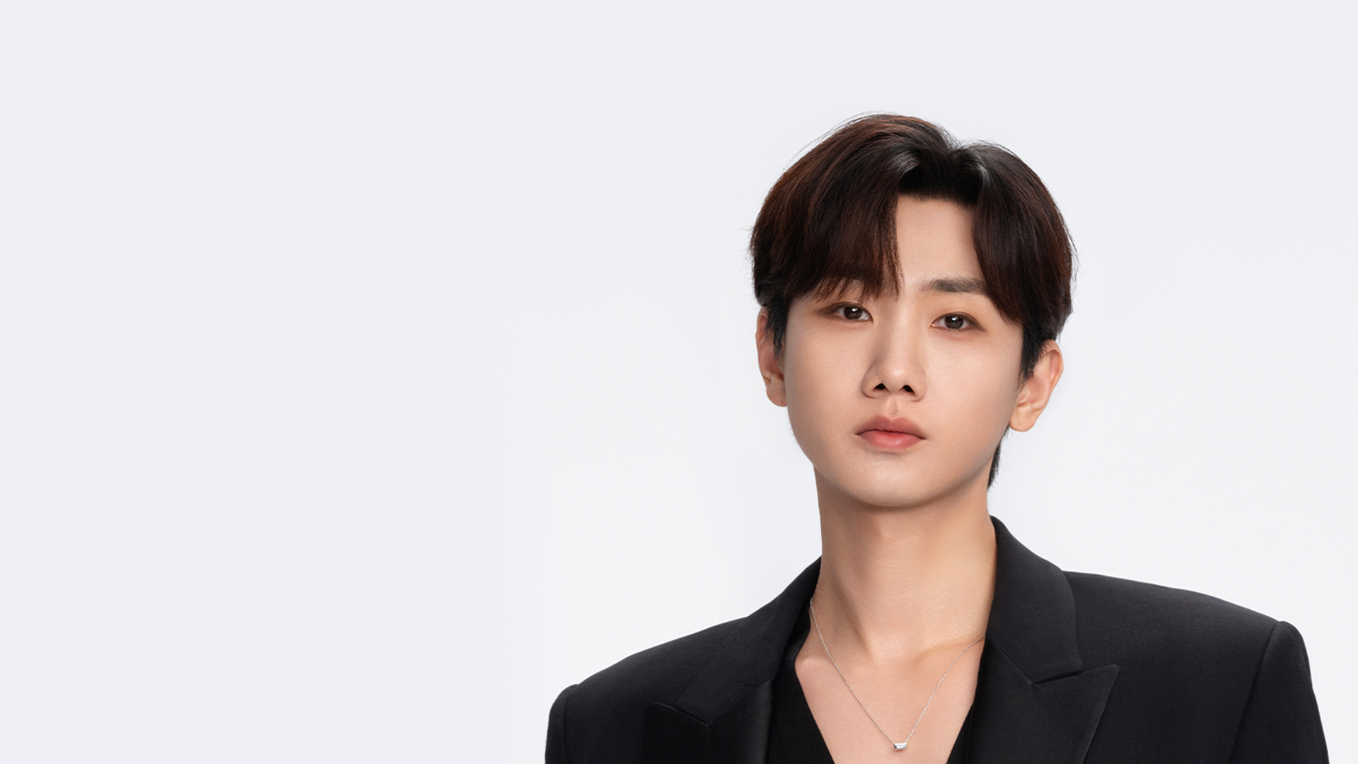 Singer Silence Wang staring at the camera against a white background.