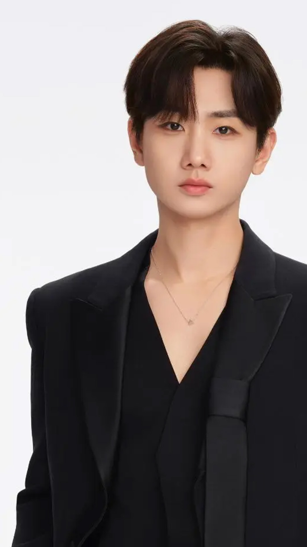 Singer Silence Wang staring at the camera against a white background.