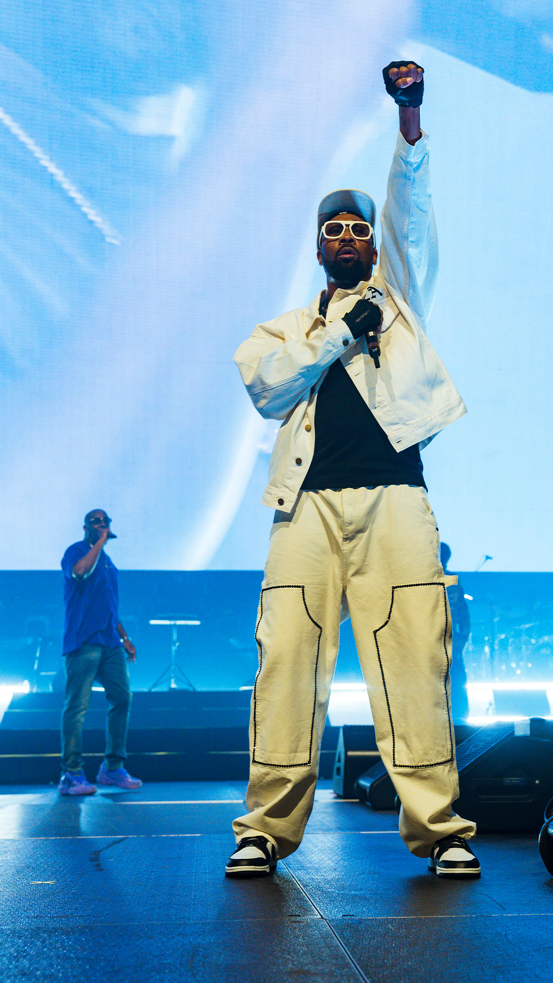 Wu-Tang Clan band members performing on stage.