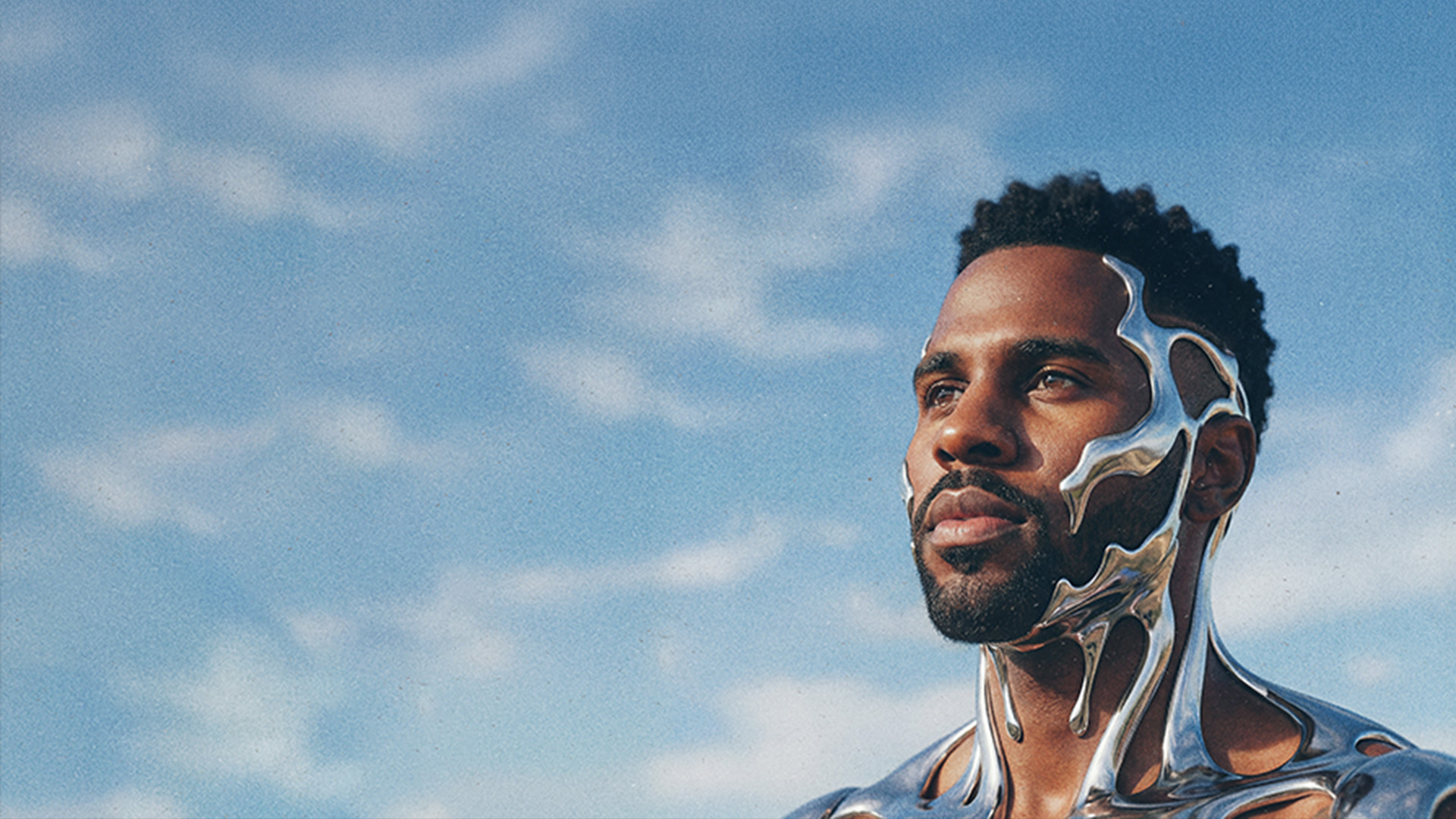 Jason Derulo depicted with a silver face and body, poses confidently against a blue sky background.